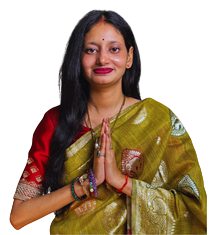 Portrait of a woman in a green and gold sari with a red blouse, hands pressed together in a namaste greeting.