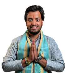 Man with a teal scarf in traditional Indian attire pressing palms together in a Namaste greeting, smiling at the camera | Prashna Kundali